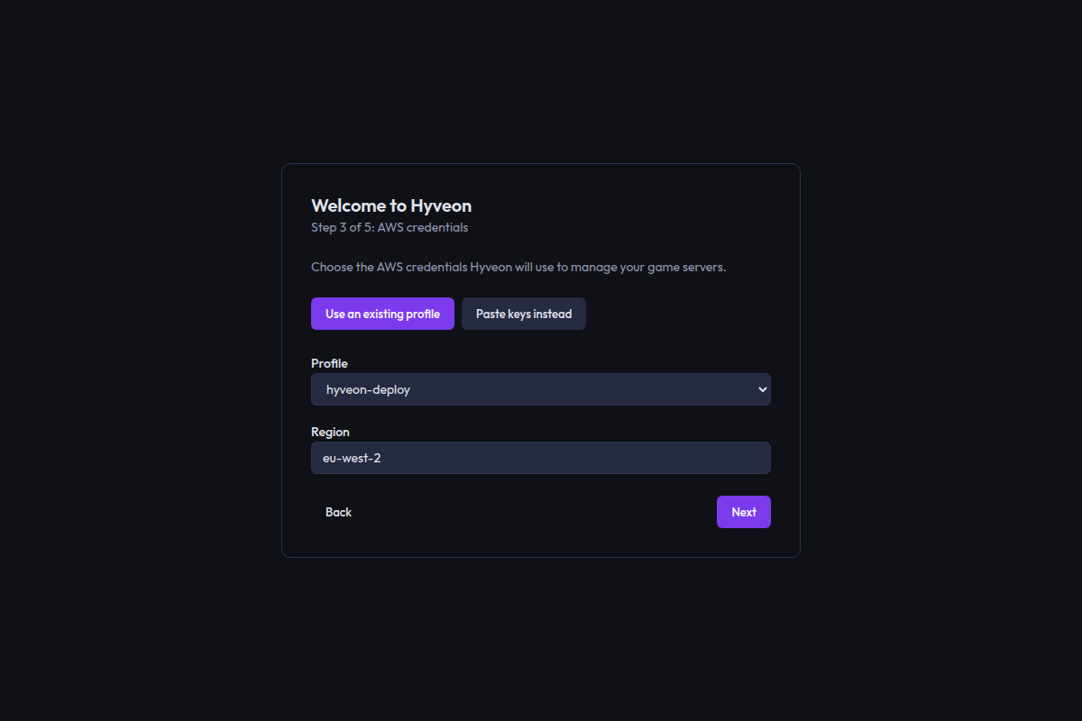 The credentials step with the Use an existing profile mode selected, a profile dropdown and a region field